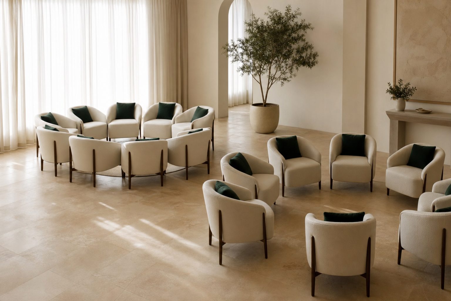 Two circles of cream chairs in a bright studio, one closed and one with an open gap